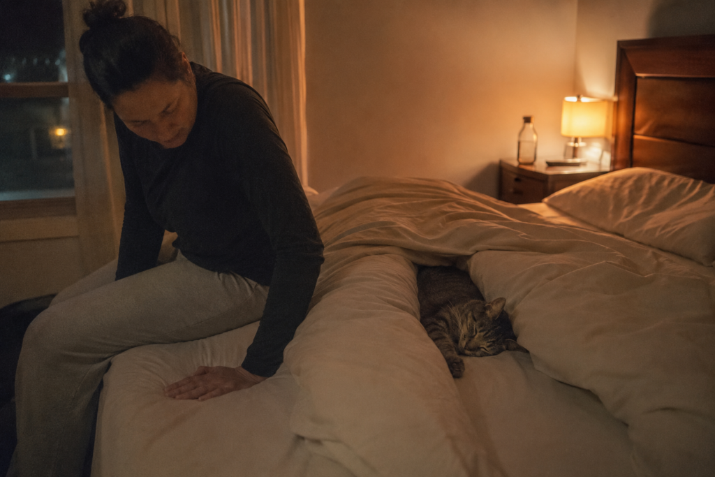 Why Does My Cat Sleep Between My Legs? 7 Real Reasons